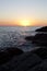 Sunset on the rocky shore. Tyrrhenian Sea