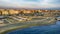 Sunset Rome aerial view in Ostia Lido beach over blue sea with city skyline and view of Ravennati square and pedestrian pier a