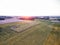 Sunset of Rural Area in Lithuania. Forest, Wheat Field and Sunset in Background.