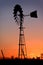 Sunset in a rural outback Australian farm silhouetting a wind pump