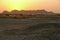 Sunset in the Sahara Desert. City in the desert.