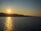 Sunset in Saint Florent Corsica â€“ France â€“ silhouette of a parasailing in background