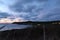 Sunset from the sand dunes of croyde bay looking out over the beach to Lundy island nestled in the sea in the far distance