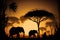 Sunset in the savannah - silhouettes of elephants in the rays of the setting sun