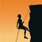 Sunset scene of black silhouette man mountain descent rock climbing