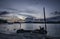 sunset scene of the fishing boats harbored at the seaside.