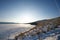 Sunset scene at Ogoy Island. Frozen ice Lake Landscape. Lake Baikal, Russia