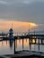 Sunset scene over Baltic sea with empty harbor