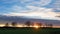 Sunset scenery country road with bare-leaved trees and some cars