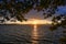 Sunset scenery of the Lake Turgoyak in a pine frame