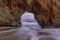 Sunset Through Sea Arch in Hole in the Wall beach.