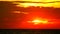 Sunset on sea back on red orange yellow cloud on sky time lapse