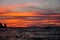 Sunset on the sea with boat, Giglio Island, Tuscany Italy