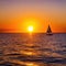 sunset sea boat water sun ocean sky sunrise sailboat ship