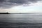 Sunset on the sea with a breakwater made of rocks