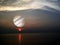 sunset on the sea and jupiter background in space