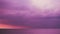 Sunset on the sea and light purple dark storm cloud in summer season