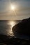 Sunset between sea and mountain arraial of cabo rio de janeiro