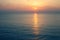 Sunset Sea over the Horizont. Beautiful Ocean Sunshine Landscape, Shimmering Twilight with yellow colors, Warm marine dusk Sun, Re