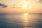 Sunset Sea over the Horizont. Beautiful Ocean Sunshine Landscape, Shimmering Twilight with yellow colors, Warm marine dusk Sun, Re