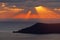 Sunset at the sea with rays and island silhouette