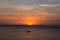 Sunset in the sea and silhouette boat . Phuket, Thailand.