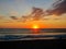 Sunset at sea in a stunning sunset with dramatic sky formed by the reflection of the sun in the clouds, in Mazatlan Mexico