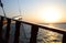 Sunset in the sea, sunset on the horizon, wooden railing of a pleasure sailboat.
