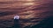 Sunset, sea and yacht on water from drone, above or landscape of ocean on calm, holiday and travel. Ship, waves and