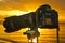 Sunset seashore view of a camera on a tripod