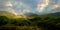 Sunset seen trees along with lake and colorful dramatic sky. Panaromic shot.