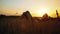 Sunset Serenity: Weary Boy Takes a Respite in the Field After Cycling