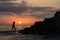 Sunset and shlhouette of a woman on the Gulf of Mexico near St. Pete Beach, Florida.