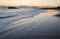 Sunset on shoreline below Heisler Park in Laguna Beach, California