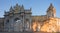 Sunset shot of closed gate leading former Ottoman Dolmabahce Palace, suited Ciragan Street, Besiktas distric. Gate contains -