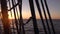 Sunset through the shrouds and rigging of an old sailing ship