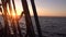 Sunset through the shrouds and rigging of an old sailing ship