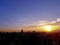 Sunset with silhouette of buildings over Johor Bahru`s cityscape