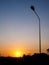 Sunset with silhouette on electric pole