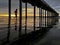 Sunset silhouette of a jogger at a beach