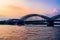 Sunset silhouette skyline landscape of the gothic Cologne Cathedra, Hohenzollern railway and pedestrian bridge, the old town and