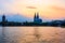 Sunset silhouette skyline landscape of the gothic Cologne Cathedra, Hohenzollern railway and pedestrian bridge, the old town and