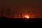 Sunset Silhouette of Transmission Towers and Railway Signals