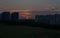 Sunset in Singgapore urban residential district. Red sky, sun and cloud formation during sunset with Condominiums and Nature