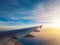 Sunset sky as seen through window of airplane, plane window. travel and vacation concept.