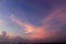 Sunset in the sky. Blue sky with pink light background at sunrise. Sky cloud backgrounds. Sky clouds with wings shaped.
