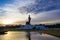 Sunset sky and Buddha statue at  Phutthamonthon,a Buddhist park in Nakhon Pathom Province of Thailand.