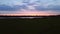 Sunset Sky over Field and River. Warm Summer Evening. Aerial View.