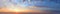 Sunset sky panorama with clouds