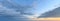 Sunset sky panorama with clouds